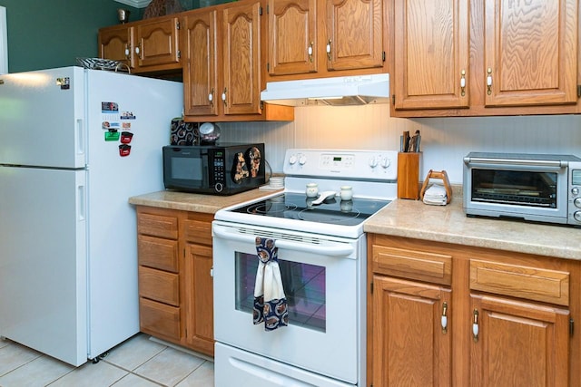 1130 Horse Mountain Rd Unit E, Shelbyville, TN 37160 - kitchen with under cabinet range hood, white appliances, light tile patterned floors, light countertops, and brown cabinets