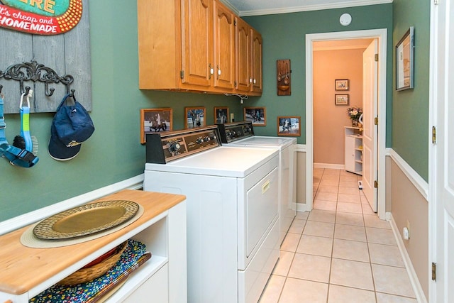 1130 Horse Mountain Rd Unit E, Shelbyville, TN 37160 - laundry area featuring independent washer and dryer, light tile patterned flooring, crown molding, cabinet space, and baseboards
