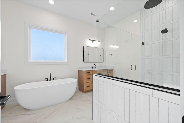 24 Fawn Mdws, Clarksville, TN 37043 - bathroom featuring a stall shower, vanity, a freestanding bath, marble finish floors, and recessed lighting