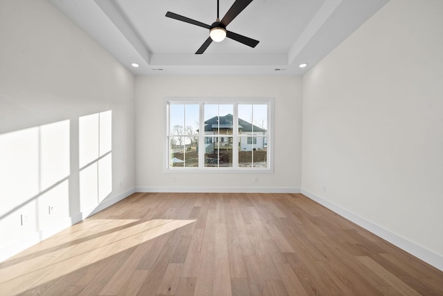 24 Fawn Mdws, Clarksville, TN 37043 - spare room with a raised ceiling, light wood-type flooring, recessed lighting, ceiling fan, and baseboards