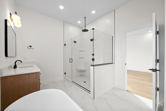 24 Fawn Mdws, Clarksville, TN 37043 - bathroom featuring marble finish floors, a stall shower, a freestanding bath, vanity, and recessed lighting