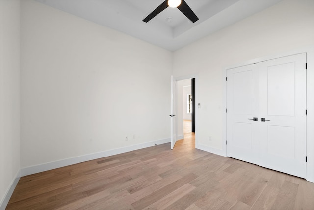 24 Fawn Mdws, Clarksville, TN 37043 - unfurnished bedroom featuring light wood-style flooring, baseboards, ceiling fan, and a closet
