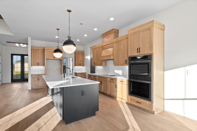 24 Fawn Mdws, Clarksville, TN 37043 - kitchen featuring black appliances, a sink, light wood-type flooring, custom exhaust hood, and recessed lighting