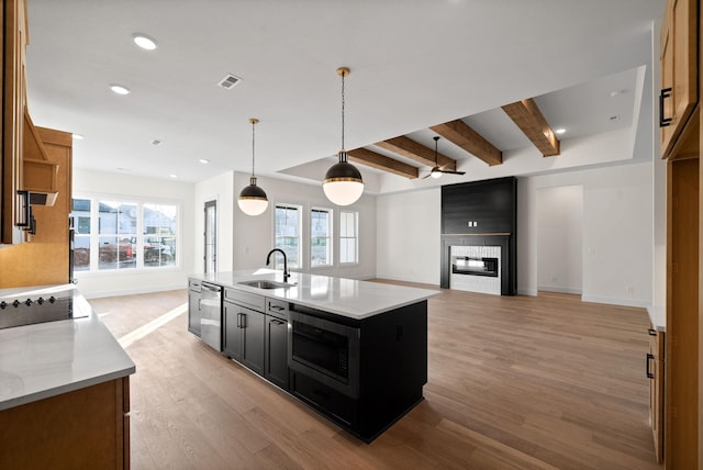 24 Fawn Mdws, Clarksville, TN 37043 - kitchen featuring built in microwave, a sink, stainless steel dishwasher, dark cabinets, and baseboards