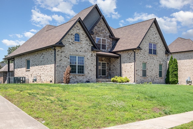 4423 Garcia Blvd, Murfreesboro, TN 37128 - french country style house featuring a front yard, brick siding, and roof with shingles