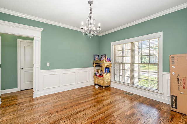 4423 Garcia Blvd, Murfreesboro, TN 37128 - dining room featuring a chandelier, wainscoting, crown molding, and wood finished floors