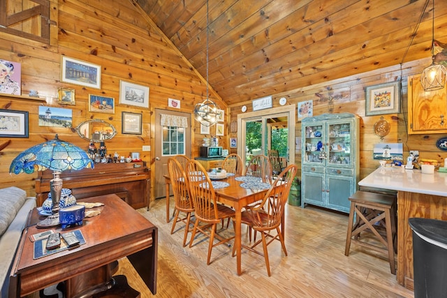 123 Hidden Trl, Dover, TN 37058 - dining room with vaulted ceiling, wooden ceiling, wooden walls, and light wood-type flooring