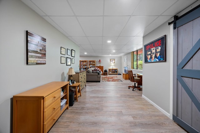 123 Hidden Trl, Dover, TN 37058 - hall featuring a paneled ceiling, light wood-style flooring, recessed lighting, and a barn door