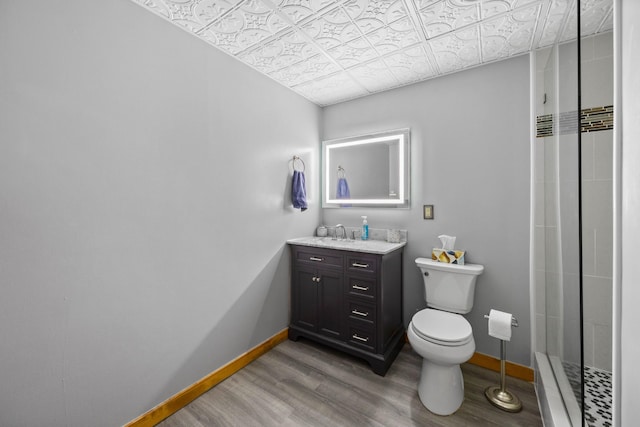 123 Hidden Trl, Dover, TN 37058 - bathroom with an ornate ceiling, wood finished floors, vanity, toilet, and baseboards