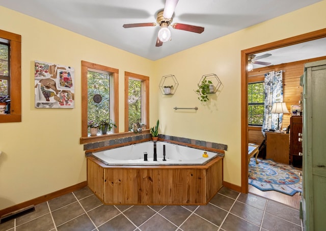 123 Hidden Trl, Dover, TN 37058 - bathroom featuring ceiling fan, a whirlpool tub, and tile patterned floors