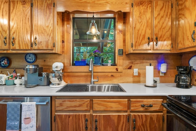 123 Hidden Trl, Dover, TN 37058 - kitchen featuring stainless steel dishwasher, a sink, light countertops, and brown cabinets
