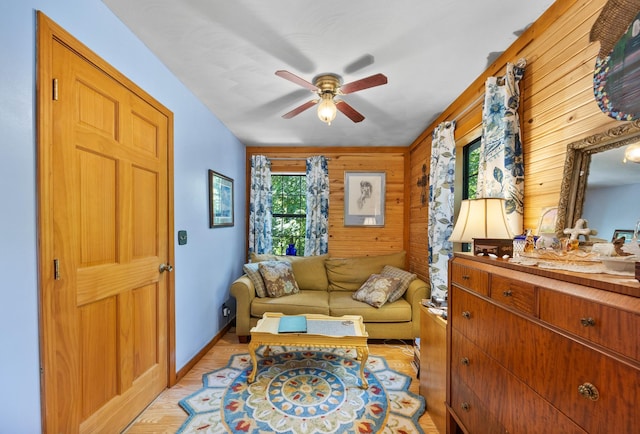 123 Hidden Trl, Dover, TN 37058 - living area with ceiling fan, wood walls, and baseboards