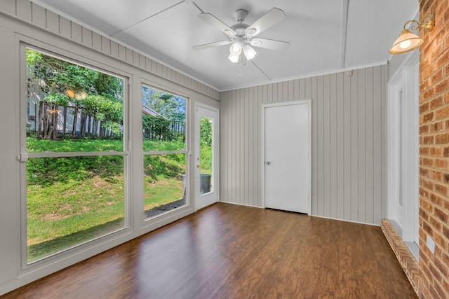 523 Williamsburg Dr, Nashville, TN 37214 - unfurnished sunroom with wood finished floors, brick wall, and crown molding