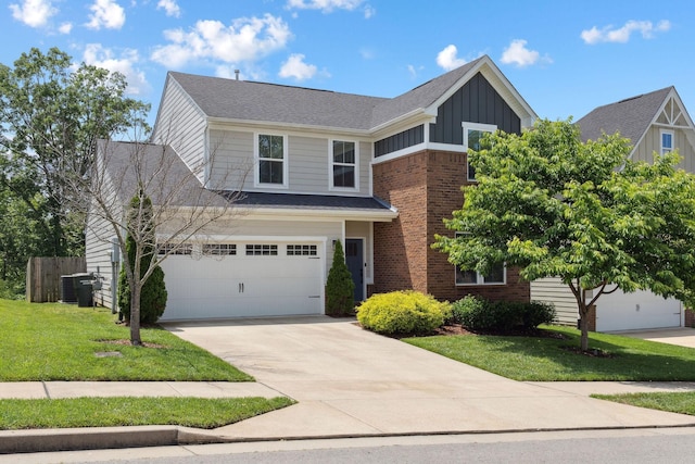 9420 Kaplan Ave, Brentwood, TN 37027 - view of front of home featuring board and batten siding, driveway, central air condition unit, brick siding, and an attached garage