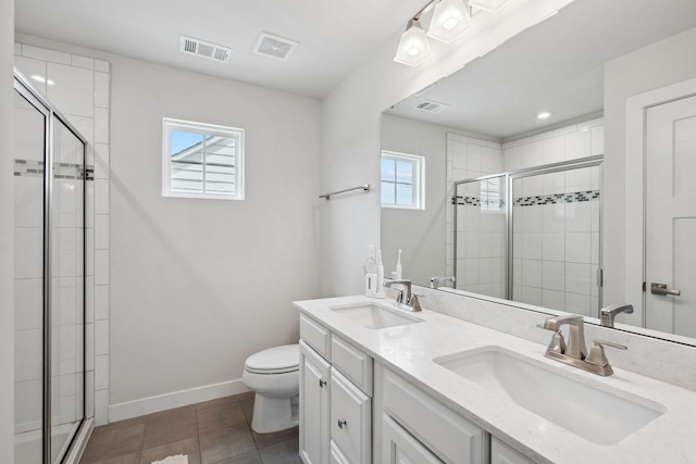9420 Kaplan Ave, Brentwood, TN 37027 - full bathroom featuring toilet, a stall shower, double vanity, baseboards, and tile patterned floors