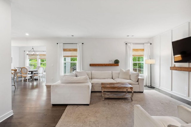 9420 Kaplan Ave, Brentwood, TN 37027 - living room with a chandelier, plenty of natural light, dark wood finished floors, recessed lighting, and baseboards
