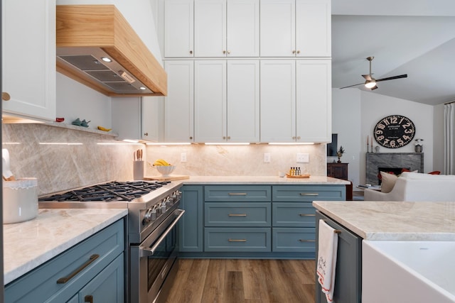 1108 Stafford Dr, Mount Juliet, TN 37122 - kitchen featuring premium range hood, high end range, white cabinets, dark wood-style floors, and lofted ceiling