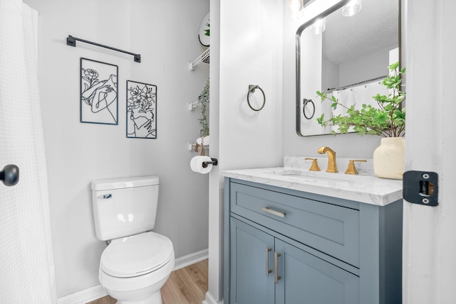 271 Golden Pond Ave, Oak Grove, KY 42262 - full bathroom with vanity, toilet, baseboards, and wood finished floors