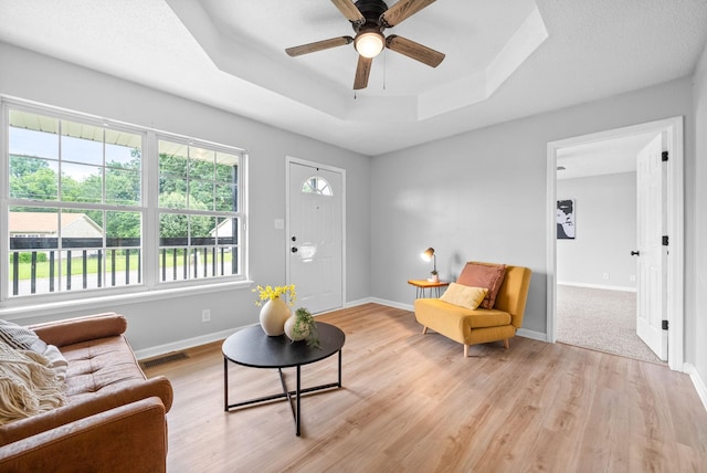 271 Golden Pond Ave, Oak Grove, KY 42262 - living room featuring ceiling fan, light wood finished floors, a raised ceiling, and baseboards