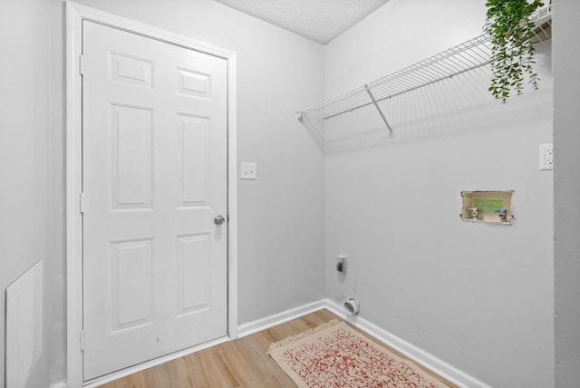 271 Golden Pond Ave, Oak Grove, KY 42262 - washroom with light wood-style flooring, hookup for a washing machine, hookup for an electric dryer, and baseboards