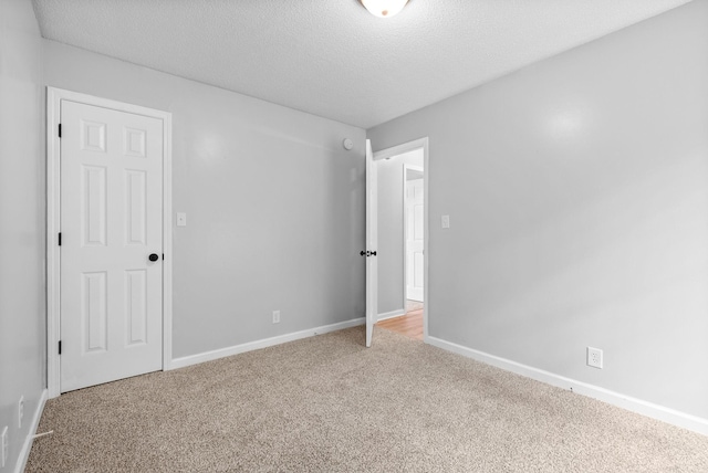 271 Golden Pond Ave, Oak Grove, KY 42262 - unfurnished room with carpet, baseboards, and a textured ceiling