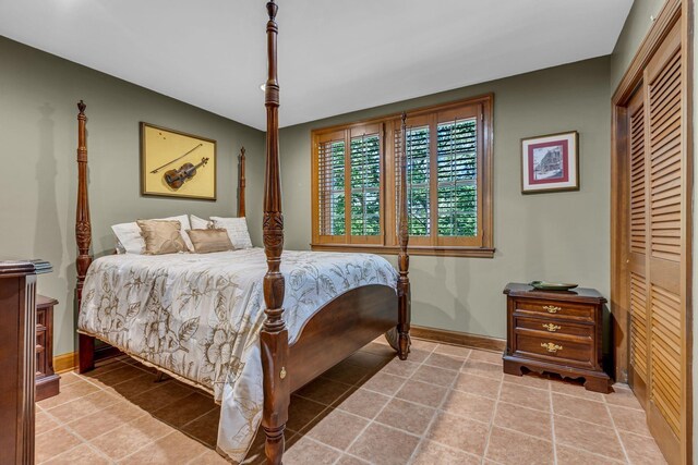 401 Ellington Dr, Franklin, TN 37064 - bedroom featuring baseboards, tile patterned floors, and a closet