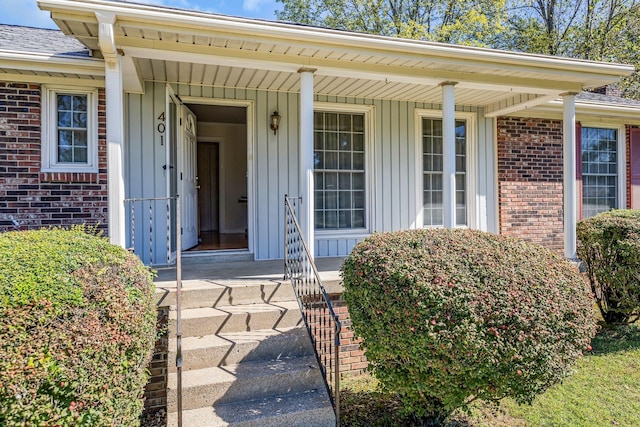 401 Ellington Dr, Franklin, TN 37064 - doorway to property with brick siding, covered porch, board and batten siding, and a shingled roof