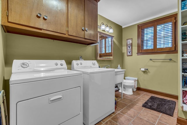 401 Ellington Dr, Franklin, TN 37064 - laundry area featuring washing machine and clothes dryer, baseboards, and a sink