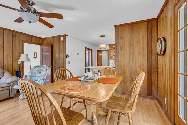 401 Ellington Dr, Franklin, TN 37064 - dining room with light wood-style flooring, wooden walls, and ceiling fan