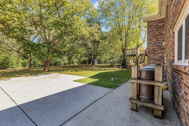 401 Ellington Dr, Franklin, TN 37064 - view of green lawn with a patio area, stairs, and view of wooded area