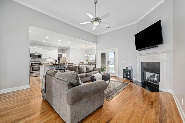 2520 Pebblecreek Ln, Murfreesboro, TN 37130 - living room with light wood finished floors, ornamental molding, baseboards, a ceiling fan, and recessed lighting