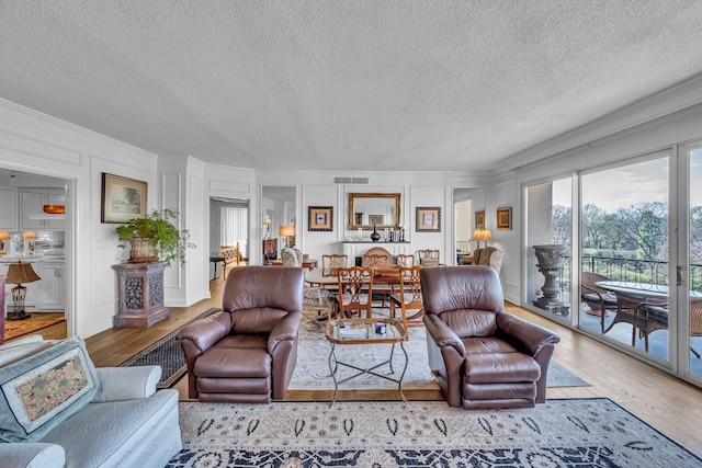 4215 Harding Pike Unit 610, Nashville, TN 37205 - living area with wood finished floors, a textured ceiling, and crown molding