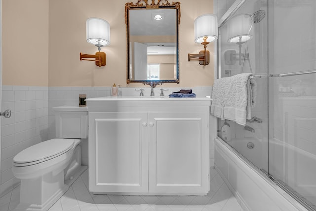 4215 Harding Pike Unit 610, Nashville, TN 37205 - full bath featuring tile walls, toilet, vanity, tile patterned floors, and bath / shower combo with glass door