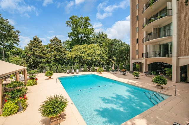 4215 Harding Pike Unit 610, Nashville, TN 37205 - community pool featuring a patio area and view of scattered trees