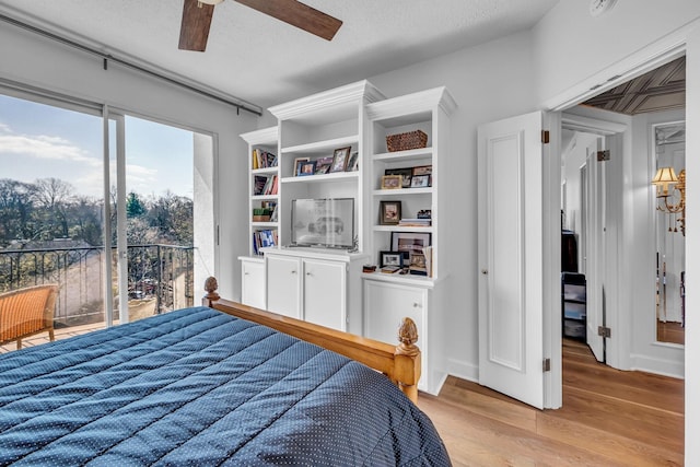 4215 Harding Pike Unit 610, Nashville, TN 37205 - bedroom with a textured ceiling, light wood-type flooring, and a ceiling fan