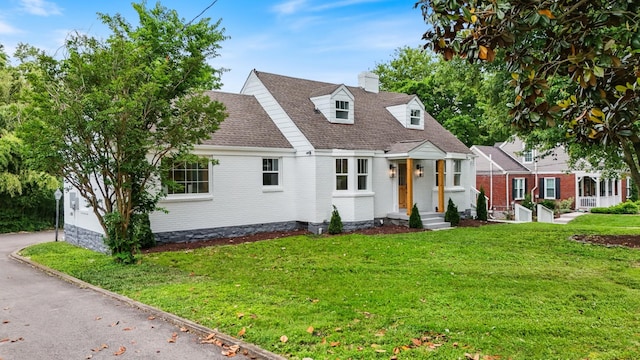1305 Riverwood Dr, Nashville, TN 37216 - cape cod house featuring a front yard, a chimney, brick siding, and roof with shingles