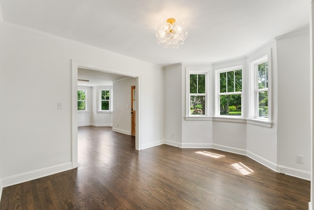1305 Riverwood Dr, Nashville, TN 37216 - empty room featuring ornamental molding, baseboards, dark wood finished floors, and a chandelier