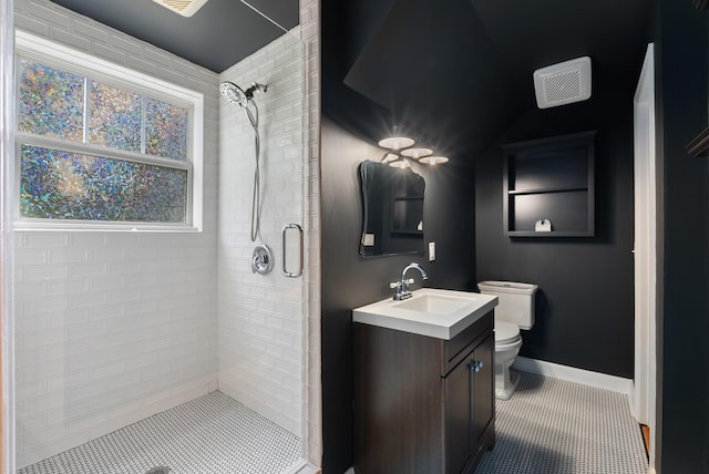 1305 Riverwood Dr, Nashville, TN 37216 - full bathroom featuring a shower stall, toilet, vanity, tile patterned flooring, and baseboards
