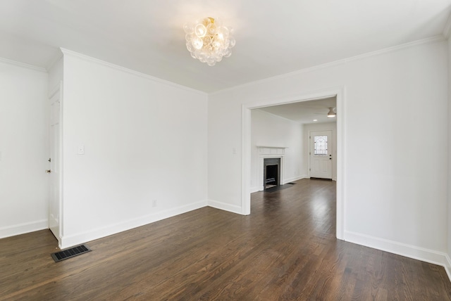 1305 Riverwood Dr, Nashville, TN 37216 - unfurnished living room with dark wood-style floors, a fireplace with flush hearth, baseboards, crown molding, and a chandelier