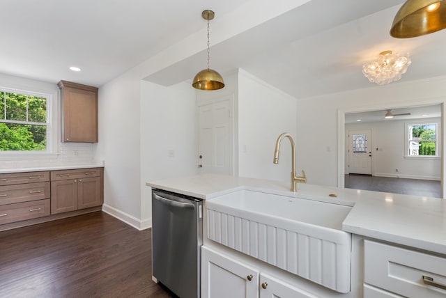 1305 Riverwood Dr, Nashville, TN 37216 - kitchen featuring dishwasher, a sink, light countertops, dark wood-style floors, and baseboards