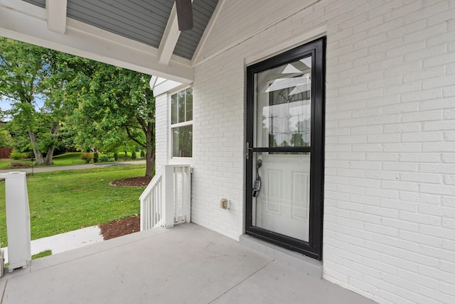 1305 Riverwood Dr, Nashville, TN 37216 - property entrance with a lawn, ceiling fan, and brick siding