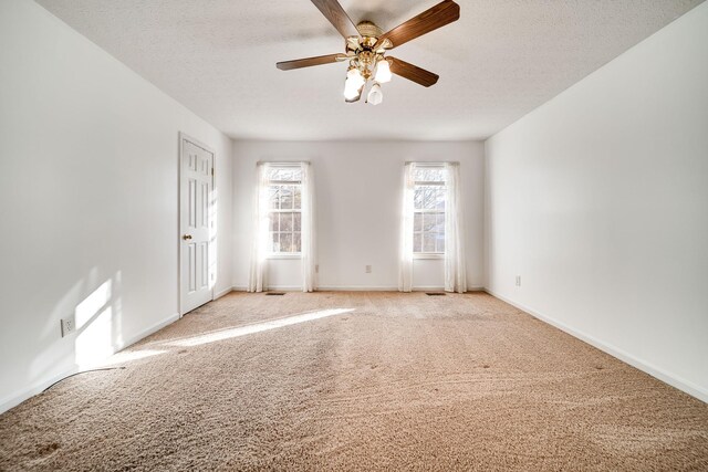 1101 Wedgewood Dr, Gallatin, TN 37066 - unfurnished room with light carpet, ceiling fan, baseboards, and a textured ceiling