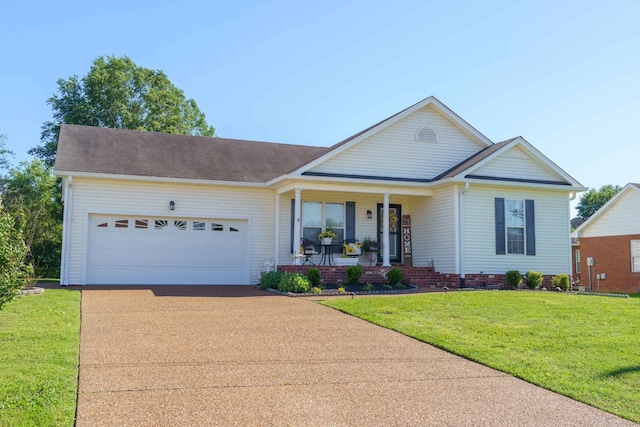 1101 Wedgewood Dr, Gallatin, TN 37066 - view of front of home featuring a porch, a garage, driveway, and a front lawn