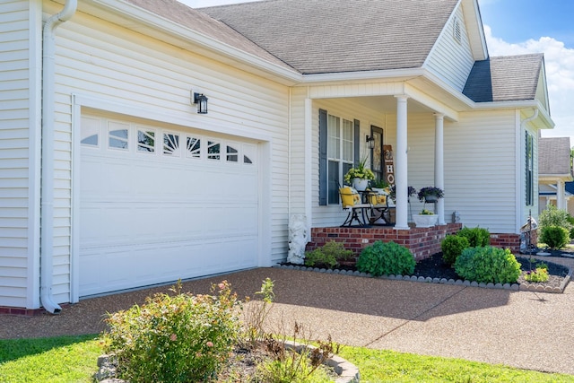 1101 Wedgewood Dr, Gallatin, TN 37066 - entrance to property with roof with shingles, an attached garage, a porch, and driveway