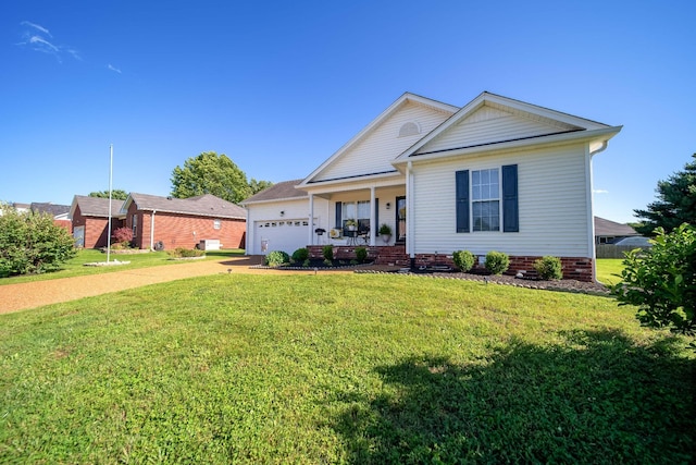 1101 Wedgewood Dr, Gallatin, TN 37066 - view of front facade with concrete driveway, a porch, a garage, and a front yard