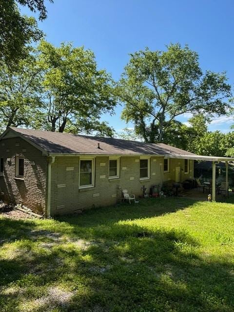 251 Spring Valley Dr E, Mount Juliet, TN 37122 - back of property featuring a lawn and brick siding