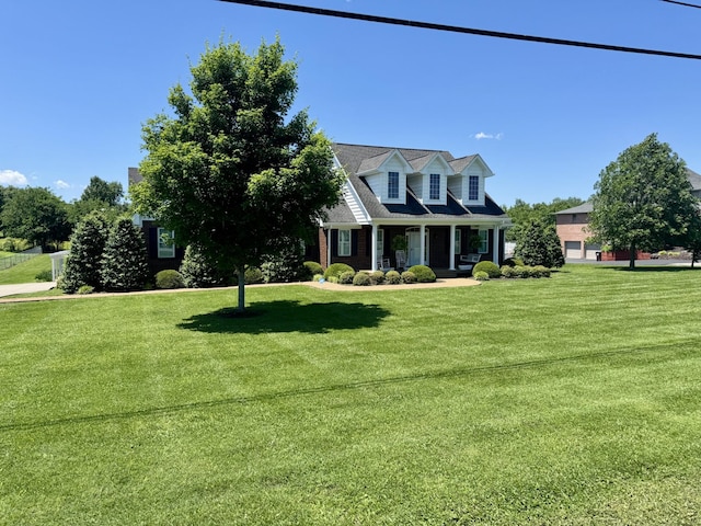 128 Mann Rd, Lebanon, TN 37087 - cape cod-style house featuring a porch and a front yard