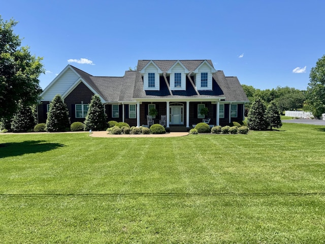 128 Mann Rd, Lebanon, TN 37087 - cape cod-style house with a porch and a front lawn
