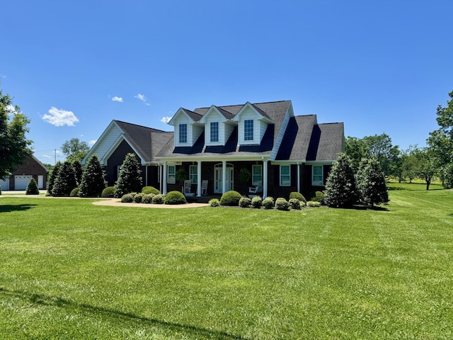 128 Mann Rd, Lebanon, TN 37087 - new england style home featuring a porch and a front lawn