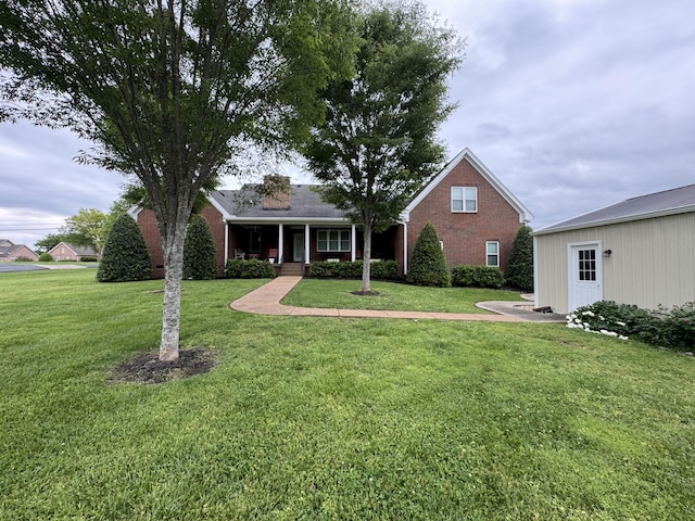 128 Mann Rd, Lebanon, TN 37087 - view of front of property featuring a front lawn, brick siding, and covered porch